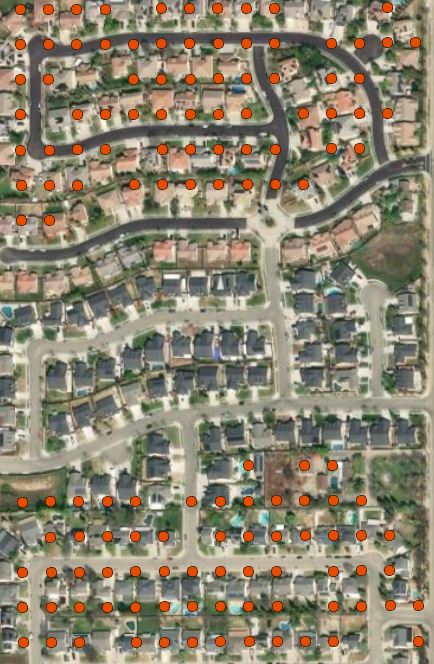Aerial image of suburban homes with population points over some but not others